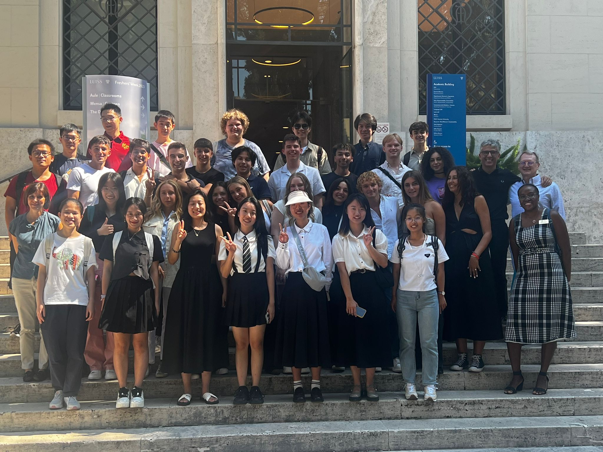 ACE & GBP Group of students from GW standing on steps in front of a building