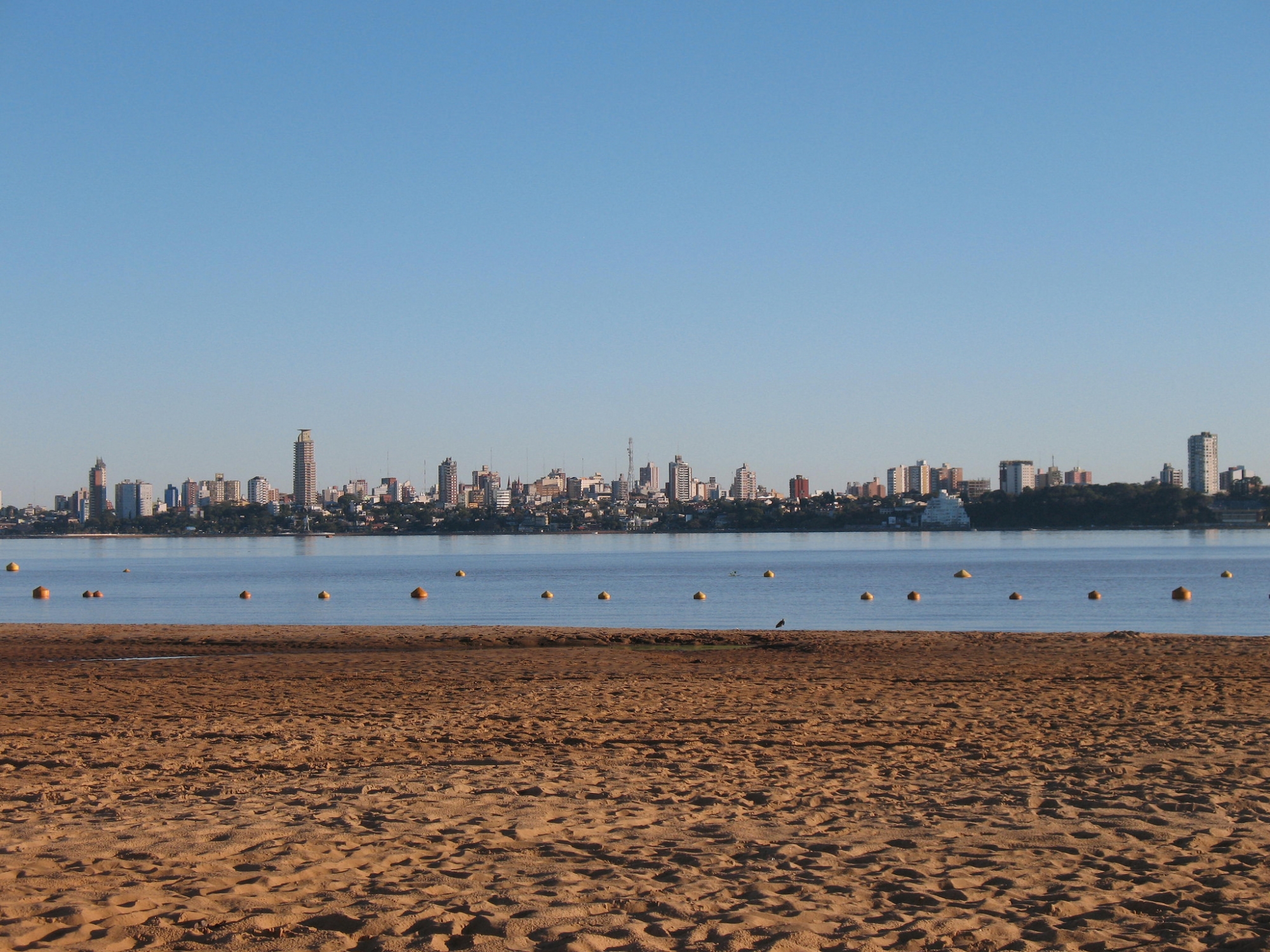 View of the city of Posadas, Argentina, from across the river on the boardwalk in Encarnación, Paraguay.