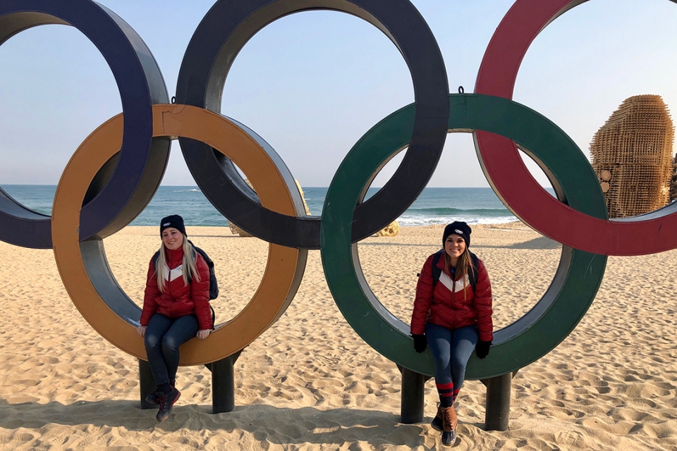 Students sitting in Olympic rings