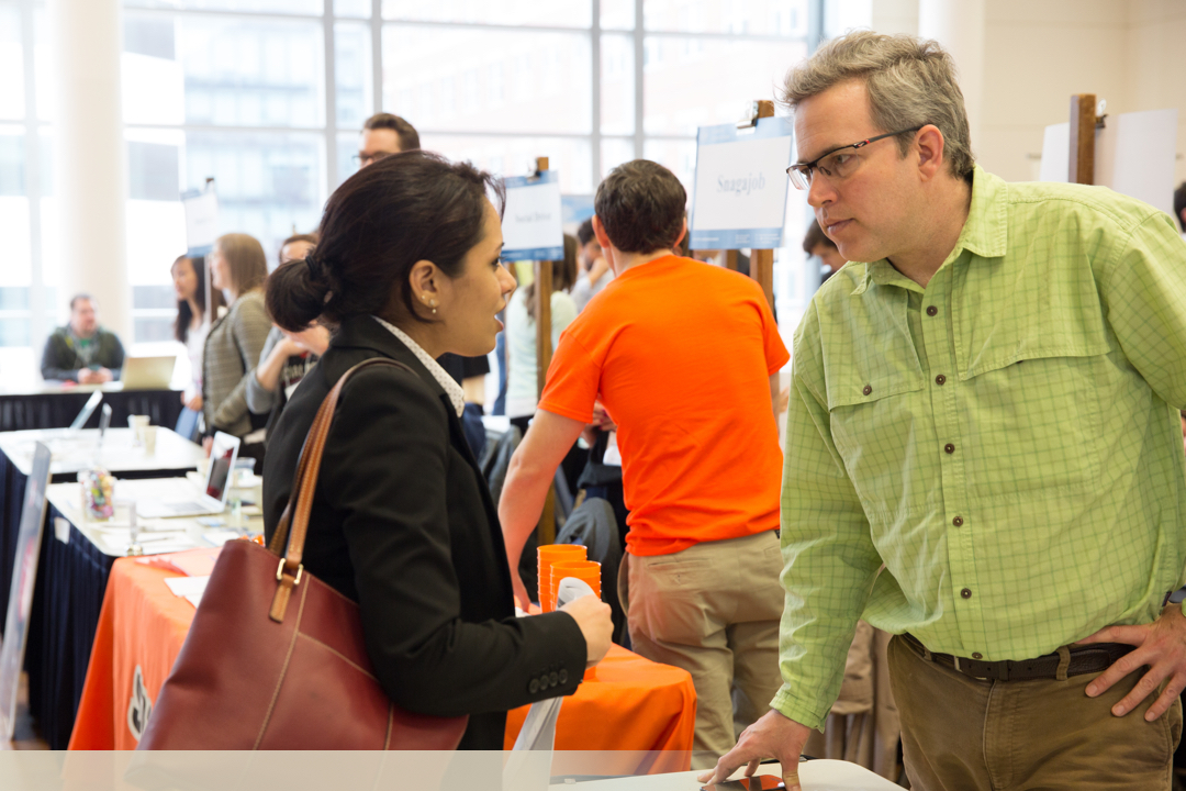 Man and woman talking at networking event