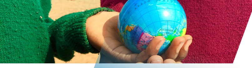 Hand holding a globe